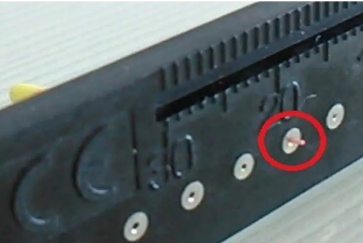 Figure 2. D 0  of gutta-percha cone exceeding the hole diameter equivalent of the  Maillefer ®  endodontic calibrating ruler.