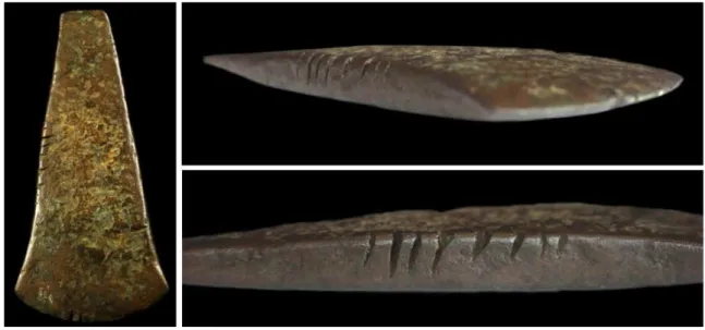 Figure 3 - The flat axe from Sabugal showing deep cuts on the blade edge and marks on the sides (Photo credit: Museu  do Sabugal and Bruno Santos)