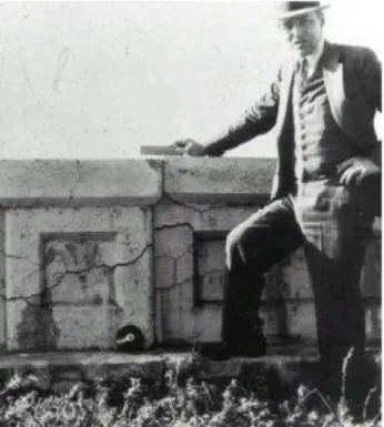 Figure 1 – Thomas Stanton standing next to a wall affected by alkali-aggregate reaction  (http://www.fhwa.dot.gov/pavement/concrete/reactive/issue01.cfm)