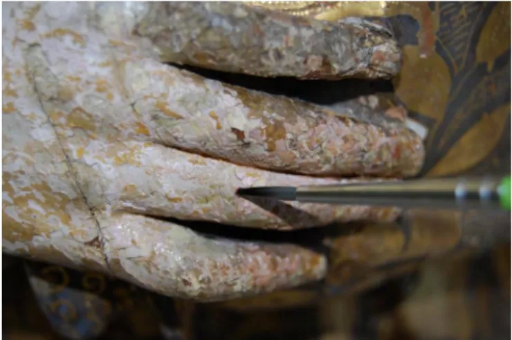 Figure 4 - Franciscan Saint: Fixing the polychrome layer with fish glue.