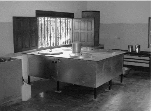 Fig. 4. Indoor solar cooker with three circular pots (80, 40 and 20 l) and one rectangular 60-l flat pot installed in a school in Nicaragua, Central America.