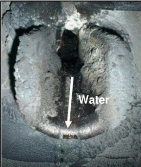 Figure 6. Water running out of spout #5 from inside the furnace, 12 hours after ESP. 