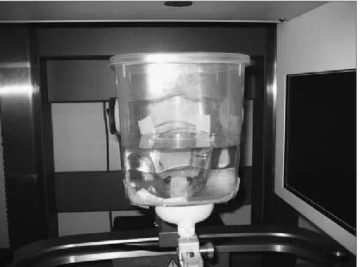 Figure 1 - Container with water  and the mandible simulating patient  position in the i-Cat Vision   device  for CBCT acquisition.