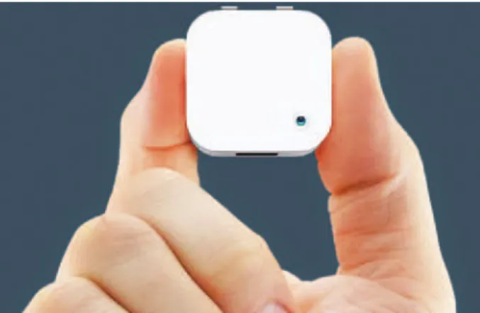 Figure 1. Narrative Clip camera. The image shows the Narrative Clip camera held  by an adult hand for size reference