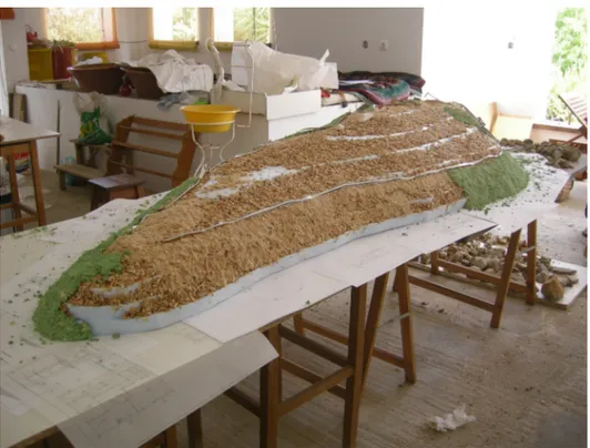 Figura 3. Processo de cobertura da topografia, com pasta de madeira.