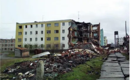 Figure 10. Irregular settling due to permafrost thaw destroyed this apartment building in Cherski, Siberia  (photo: Vladimir Romanovsky, in Schaefer et al., 2012)