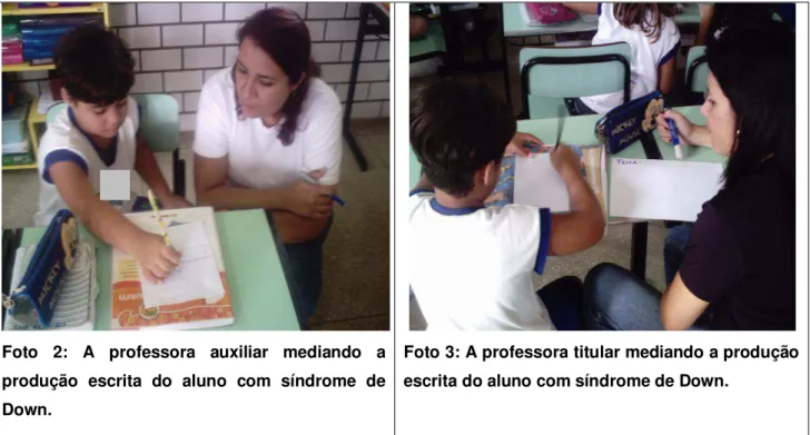 Foto  2:  A  professora  auxiliar  mediando  a  produção  escrita  do  aluno  com  síndrome  de  Down