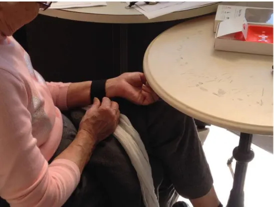 Figure 3.9: Usability evaluation test. Participant trying to put the sensor on his wrist.