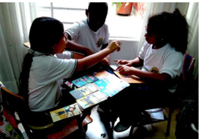 Fig. 5. Children working in groups with printed cards. 