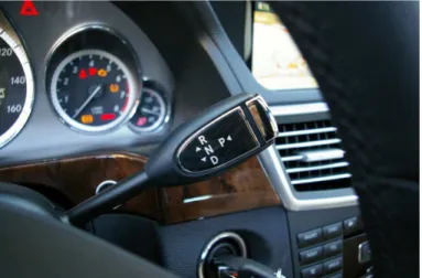 Figure 1.7: Steering column automatic mode selector lever from a 2010 Mercedes-Benz E350, with the four common modes: R, N D and P [7].
