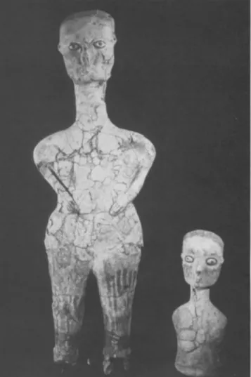 Figure 7 Restored plaster statue (left) and bust from the 1983 cache. The taller figure is approximately 90 cm high