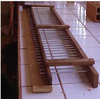 FIGURE  1.  Wood  template  with  parallel  rods  of  stainless  steel,  separated  by  0.02  meters,  constructed for assembly of TDR probes