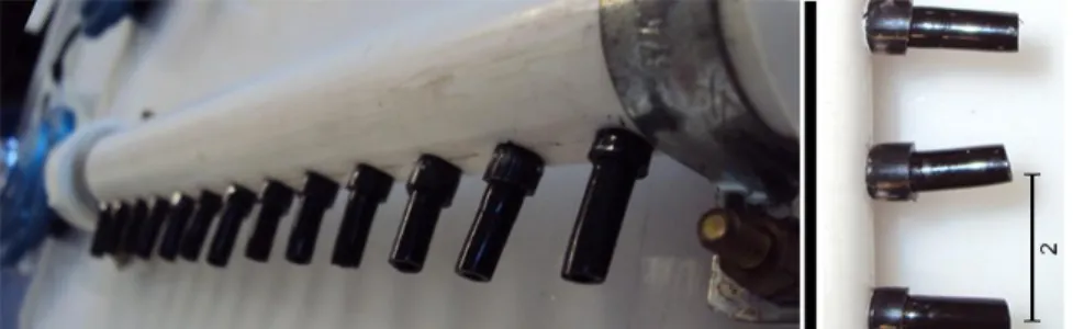 FIGURE 1. Side  view of  the  gas distributor tube with outputs  fixed by  rings  (left)