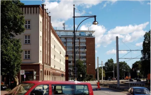 Figure 2. Rostock, eastern end of Lange Straße (view to the  east,  2011),  modern  partially  brick-clad  residential  high-rise  building (Alfred Radner, 1959-1960) and earlier built Block E  in  ‘National  Tradition’  with  adaptions  of  Northern  Germ