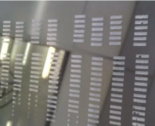 Figure 12: Photograph of the first laser test in ITO glass. Each column is associated with a fixed speed  (decreasing from left to right), while each row corresponds to a fixed power (decreasing downwards)