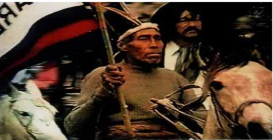Foto  de  Bernardino  Garcia  de  Tacuarembò,  neto  de  charruas  e  bisneto  do  cacique  Sepé,  tomada  em  23  de  setembro  de  2000,  desfilando  vestimentas  típicas  dos  charruas,  montado  “em  pelo”  junto  com  a  cavalaria  gaúcha