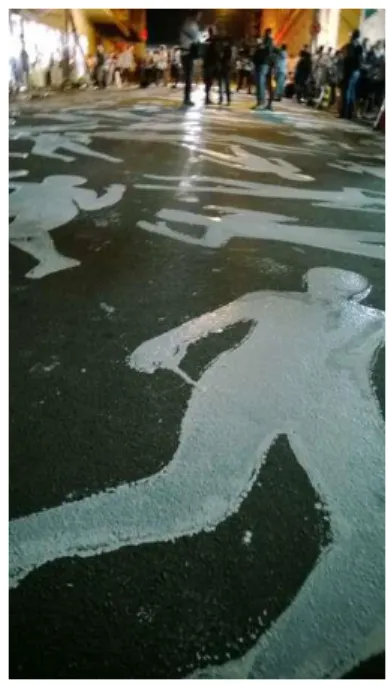 Figura 16 -- Silhuetas de corpos pintadas na rua 