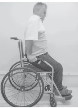 Figure 1 - Patient with SCI performing a push-up maneuver for pressure relief.