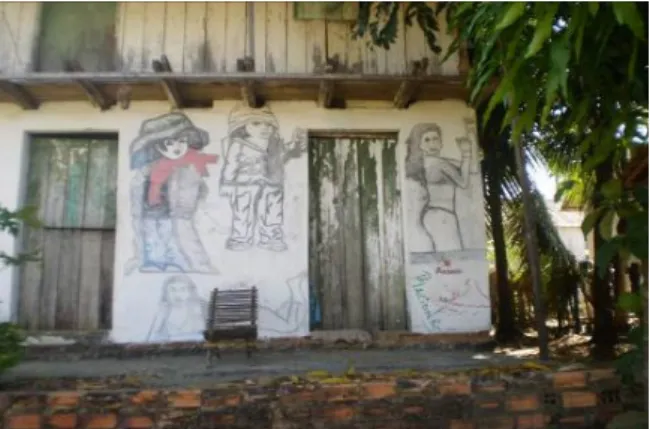 Figura 4: Pintura com carvão na parede de uma moradia. Foto: Graça Santana (2007) 