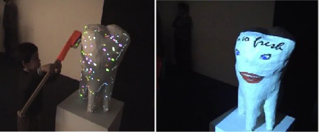 FIGURE 5-2 A child interacting with the tangible interface and the cleaned tooth. 