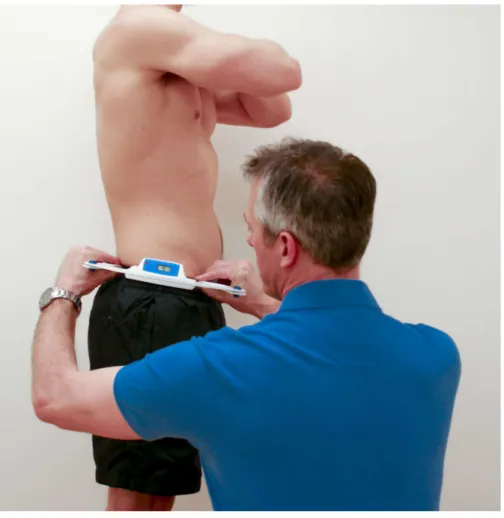 Figure 1 Measuring pelvic tilt using the DPI. Standing position maintained by subject, while rater mea- mea-sured pelvic tilt using the DPI.