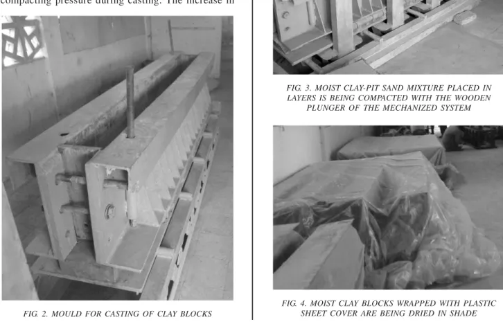 FIG. 3. MOIST CLAY-PIT SAND MIXTURE PLACED IN LAYERS IS BEING COMPACTED WITH THE WOODEN