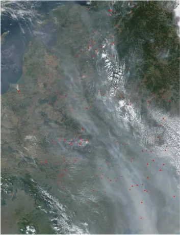 Fig. 6. MODIS satellite image (visible channel) including fire hot spots (red dots) over Ukraine and Russia on 26 August 2002, 09:45 UTC