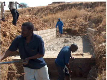 Fig. 6. Constructing the H-Flume in the Potshini catchment.