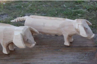 Fig. 13 - Representação de porcos em madeira . 