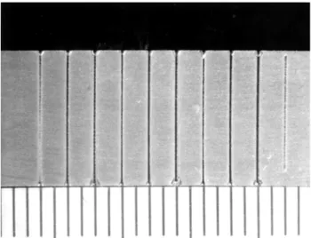 Figure 1.  Laser welding on the aluminum surface (milimetric di- di-visions).