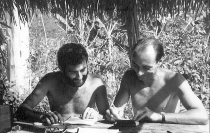 Figure 11. Zebba and Hilbert planning the day’s shooting at the table they constructed in their hut