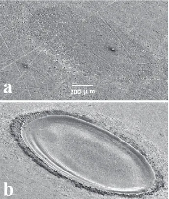 Figure 5. Photographs of aluminum samples showing the ablation cra- cra-ters produced by (a) one pulse and (b) one thousand consecutive laser pulses.