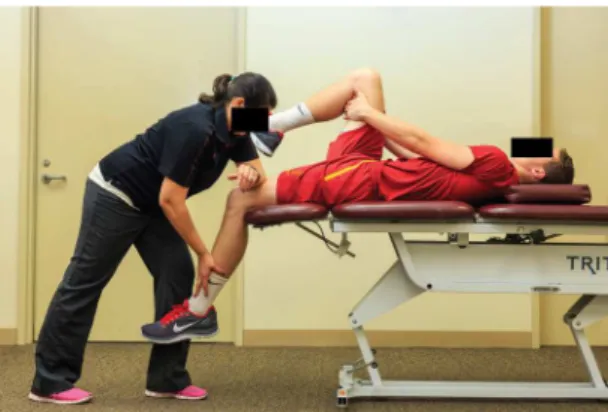 Figure 6. A passive soft-tissue technique to the distal quadriceps  region aiming at improving tissue extensibility.