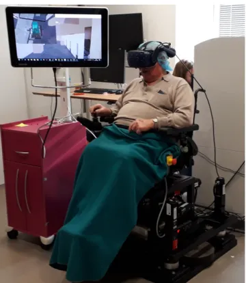 Figure 1: VR setup with our power wheelchair simulator.