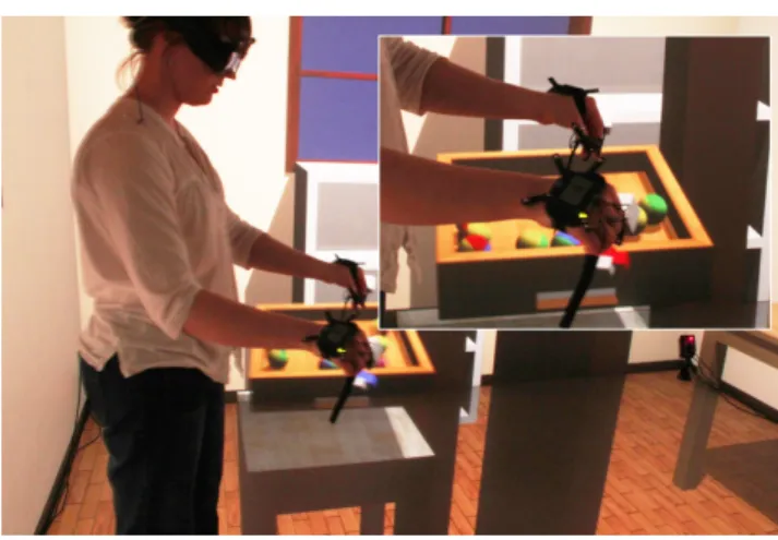 Fig. 1 A user in the four-sided cube holding a tray with two hands.