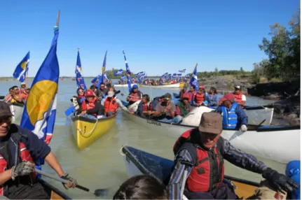 Figure 2 Tł ̨ ı ch ǫ  ‘Trails of Our Ancestors’ canoe party arriving at Behchok ǫ̀ , 2013