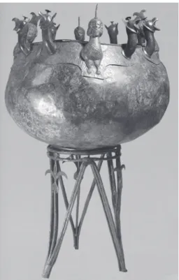 Fig. 8 – Tripod cauldron from Olympia,  9 th  century. Height 65 cm. Feet and handles are  cast and riveted to the hammered bronze cauldron.