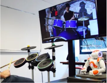 Figure 1. The interactive system: a Xbox Drums Band  controller, a Nao robot and one of the MARC toolkit virtual 