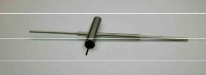 Fig.  8  :  Optical  module  of  the  sensor  inserted  in  a  body  with  a  piston  simulating  the  feeler piece (CEA, R&amp;D)