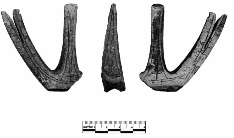 Figure 10. Punuk counterweight (three views) of ivory recovered from the middle component in Mound 2 at Uivvaq  (02-1275).