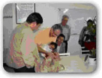 Fig. 9. French and chinese clinicians ausculting a chinese child during the last Chain of Hope mission in Chuxiong, PRC