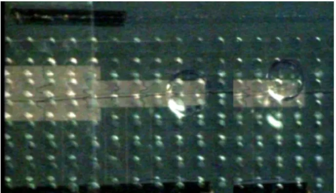 Fig. 9. Demonstration of the vertical displacement in the device. A deionized water droplet moves up from the chip array (left) to the top glass plate (right).