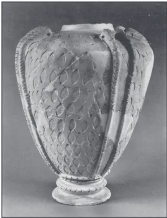 Fig. 2a - Relief de banquet. Registre sup., banquet au  son de la lyre : le personnage de gauche porte un vase 