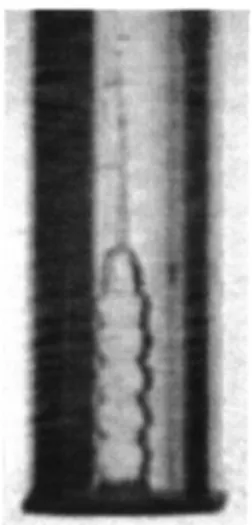 FIG. 15. Water column rising in a tube (R⫽20 mm) where a diaphragm 共of radius 10 mm 兲 partially closes the bottom.