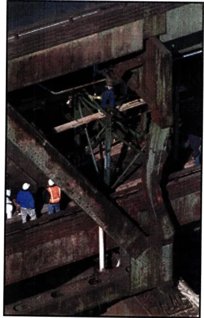 Figure  1-1:  Buckling  phenomenon  in  a  real,  full-scale  structure.  A  30-foot  tall  support  beam buckled after being hit by a truck in a May 2, 1996 accident  on Interstate 93 in Boston, Massachusetts ([8])
