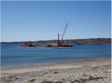 FIGURE 1.  Barge and dredge located over eelgrass bed at  Pavilion Beach during outfall construction