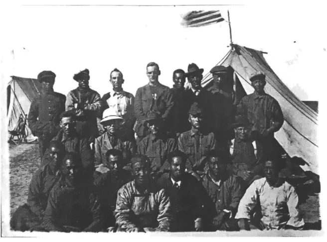 Figure 7.  An Americanflag waves  over thepersonnel of the Third.Asiatic Expedition, 1923.
