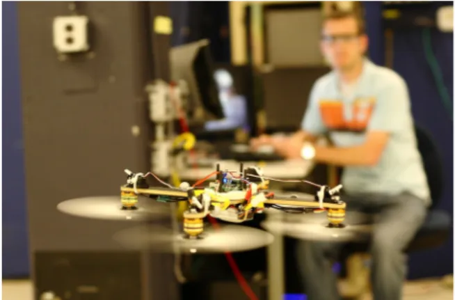 Fig. 1 The variable-pitch quadrotor during inverted flight. The symmetry introduced by the variable-pitch propellers allows the quadrotor to fly equally well upright or inverted.