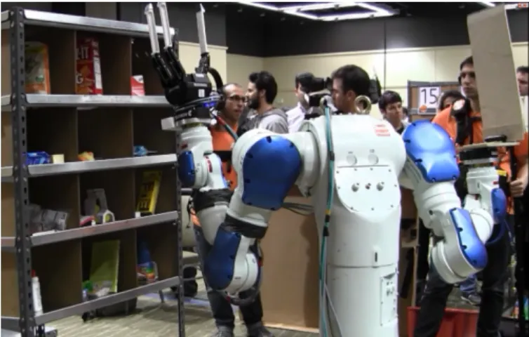 Fig. 4. Yaskawa Motoman with a Robotiq 3-fingered hand with custom extensions and scooping mechanism used by the Worcester Polytechnic Institute (WPI) team.