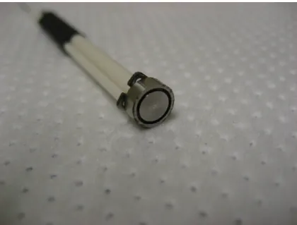 Figure 3-4: A photograph of the Faraday probe built for use in the mHTX@MIT program showing details of the guard ring, collector plate, and ceramic sheath.